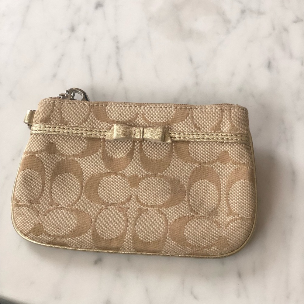 Gold coach wristlet